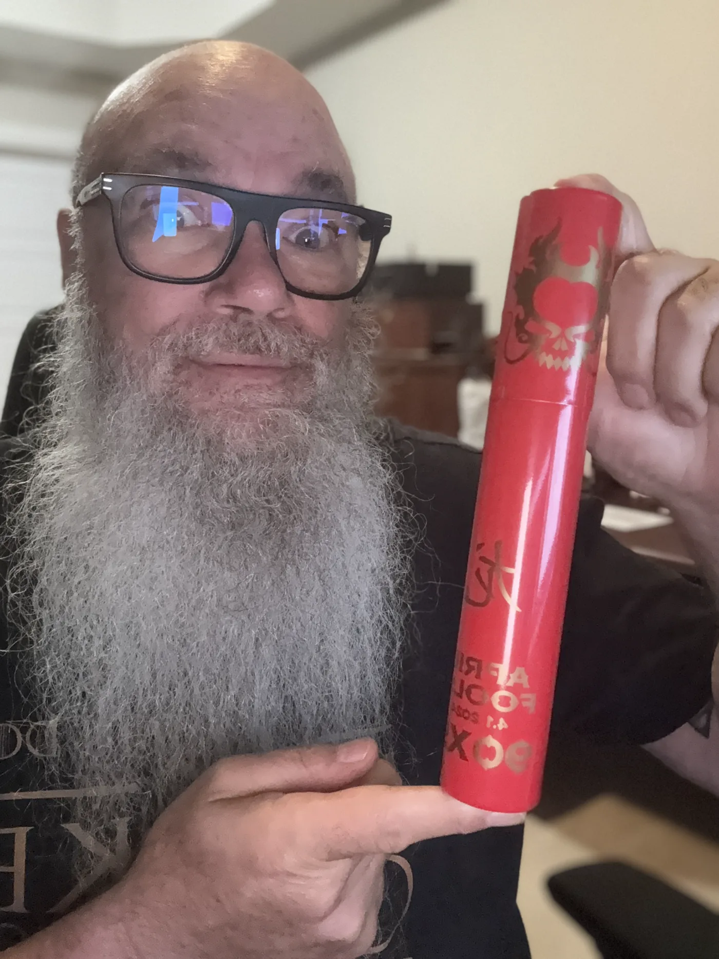 Norm Farrar holding an Asylum April Fools tube