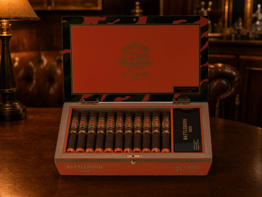 Open orange Perez-Carrillo Battleborn 2026 Heroes box with 21 toros and the camouflage lid on a lounge table